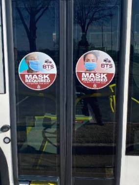 COVID-19 stickers on BTS bus doors