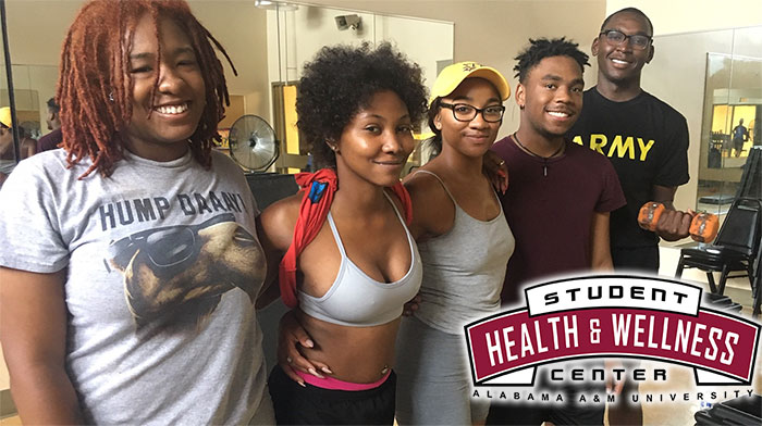 Cover photo for Wellness Center video. Students pose for a photo after a step & strength class.