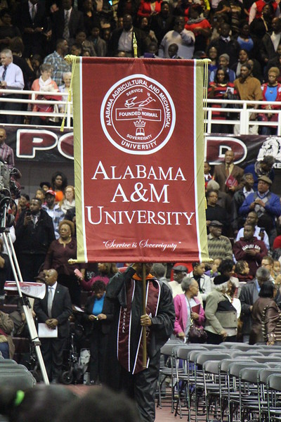 AAMU banner is proudly carried forward during a Commencement ceremony